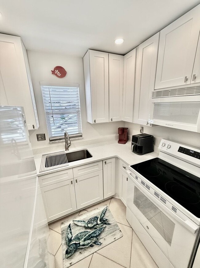 Photo - New throughout and on the Beach! Sea Villas +55 Community Unit C4 - TARPON 1205 #C4