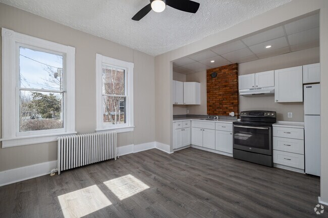 3BR, 1BA - 1,050SF - Kitchen and Dining Area
