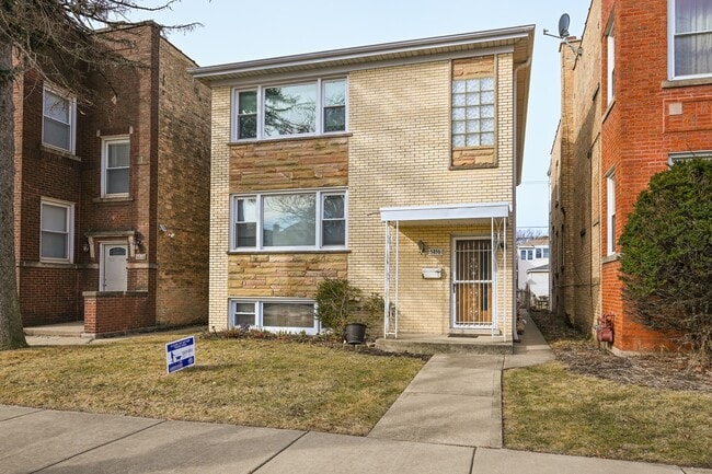 Photo - 5850 N Mulligan Ave Unidad 1