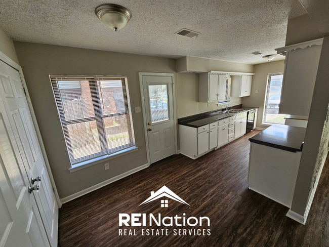 Photo - Move-In Ready 3BR Gem in Memphis - Cozy Fireplace, Tile Dining & Private Yard