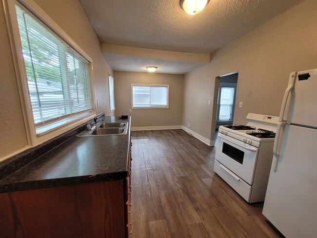 Photo - Two bedroom home with partially fenced yard!