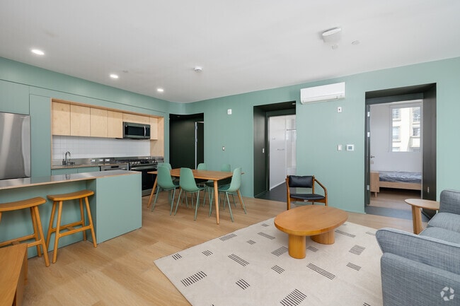 4BD, 2BA - 987SF - Living Room - Comma Barrington