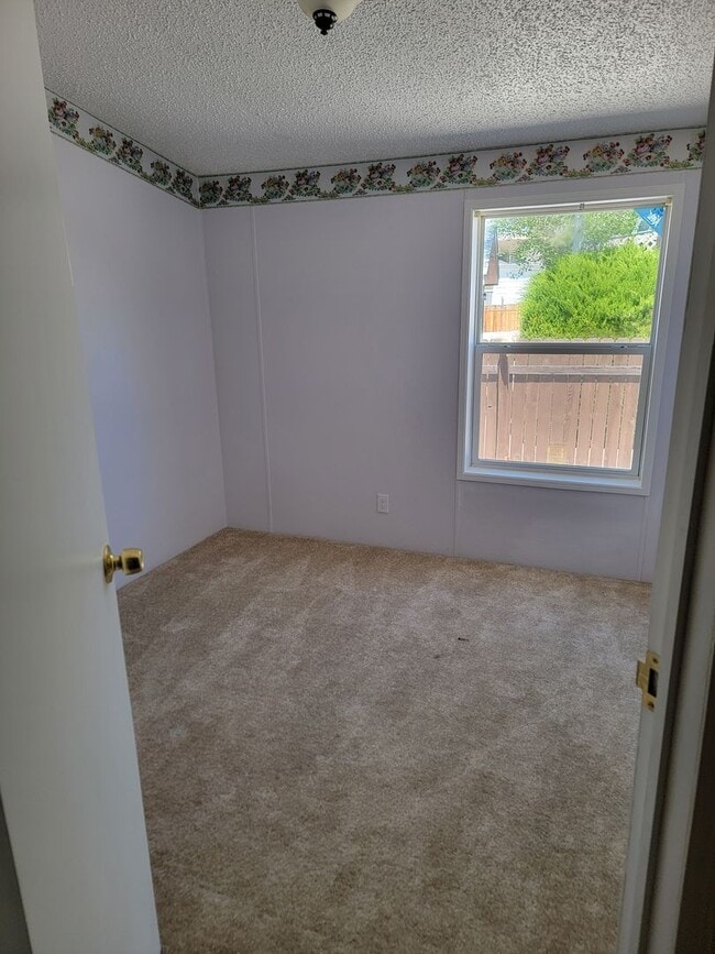 Photo - Bright 3-Bed, 2-Bath Home with Yard in 55+...