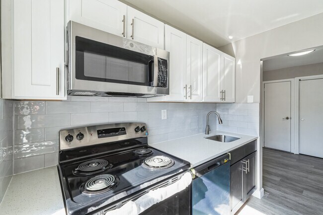Upgrade your lifestyle at Parkside Apartments with a sleek, modern kitchen featuring stainless steel appliances and elegant finishes. Cook and entertain in style! Schedule your visit today and see it for yourself.