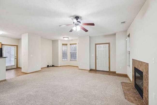 Spacious living areas create a comfortable place to relax, gather with friends, or enjoy a quiet evening by the fireplace. - Stone Ridge Estates Apartments & Duplexes