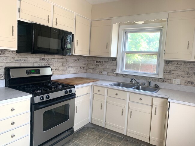 Photo - Three bedroom home with beautiful hardwood floors and central air!