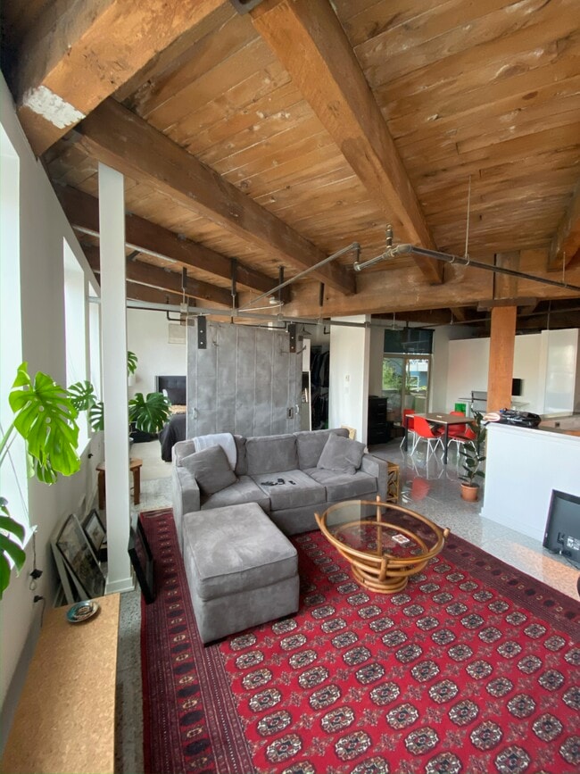 Living area separated by metal partition - 1408 12th Ave Unit 204