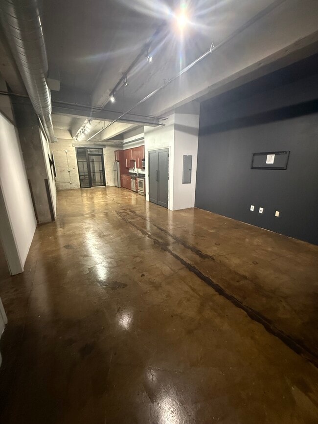 Living room to kitchen - 360 W Pershing Rd Unit Liberty Loft 130