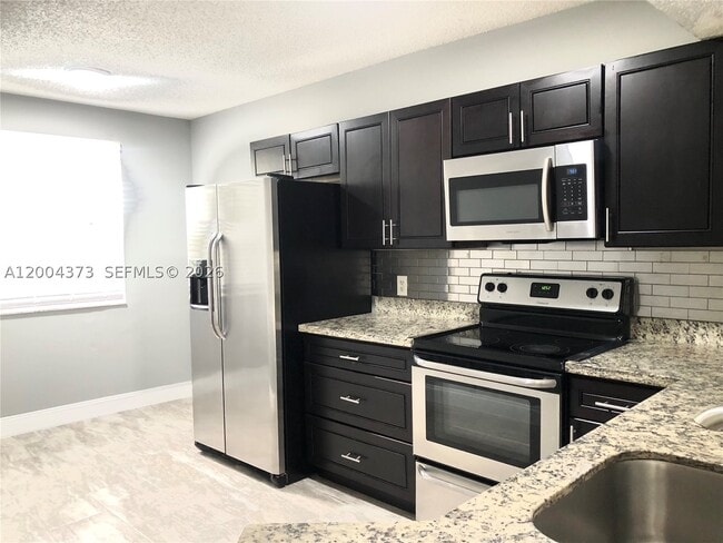 Photo - 8761 Wiles Rd Unit 306