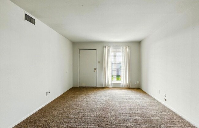 Spacious living room. - 9641 Hollock St Unit 9641 Hollock St