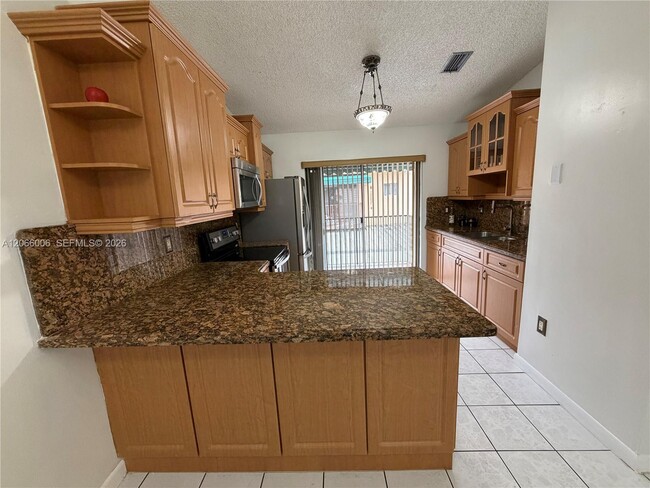 Photo - 7792 W 29th Way Unidad 202