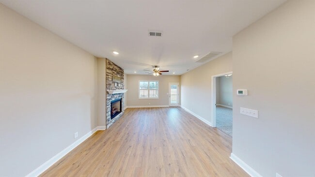 Photo - Stylish Home with Feature Stone Front Fireplace, Open Layout and Premium Upgrades