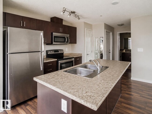 Photo - #325 5515 7 AV SW