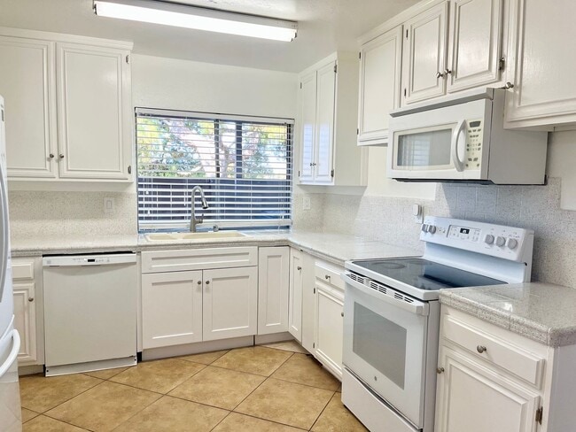 Photo - Spacious 3 Bedroom 2 Bathroom Town-Home with In-Unit Laundry, Pool and 2 Parking Spaces!