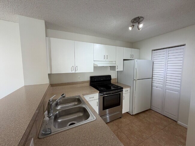 Photo - End unit with private side entrance! Unit #208