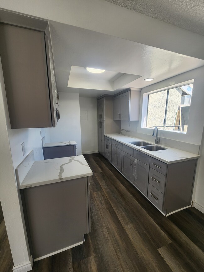 Photo - 1451 W 146th St Townhome