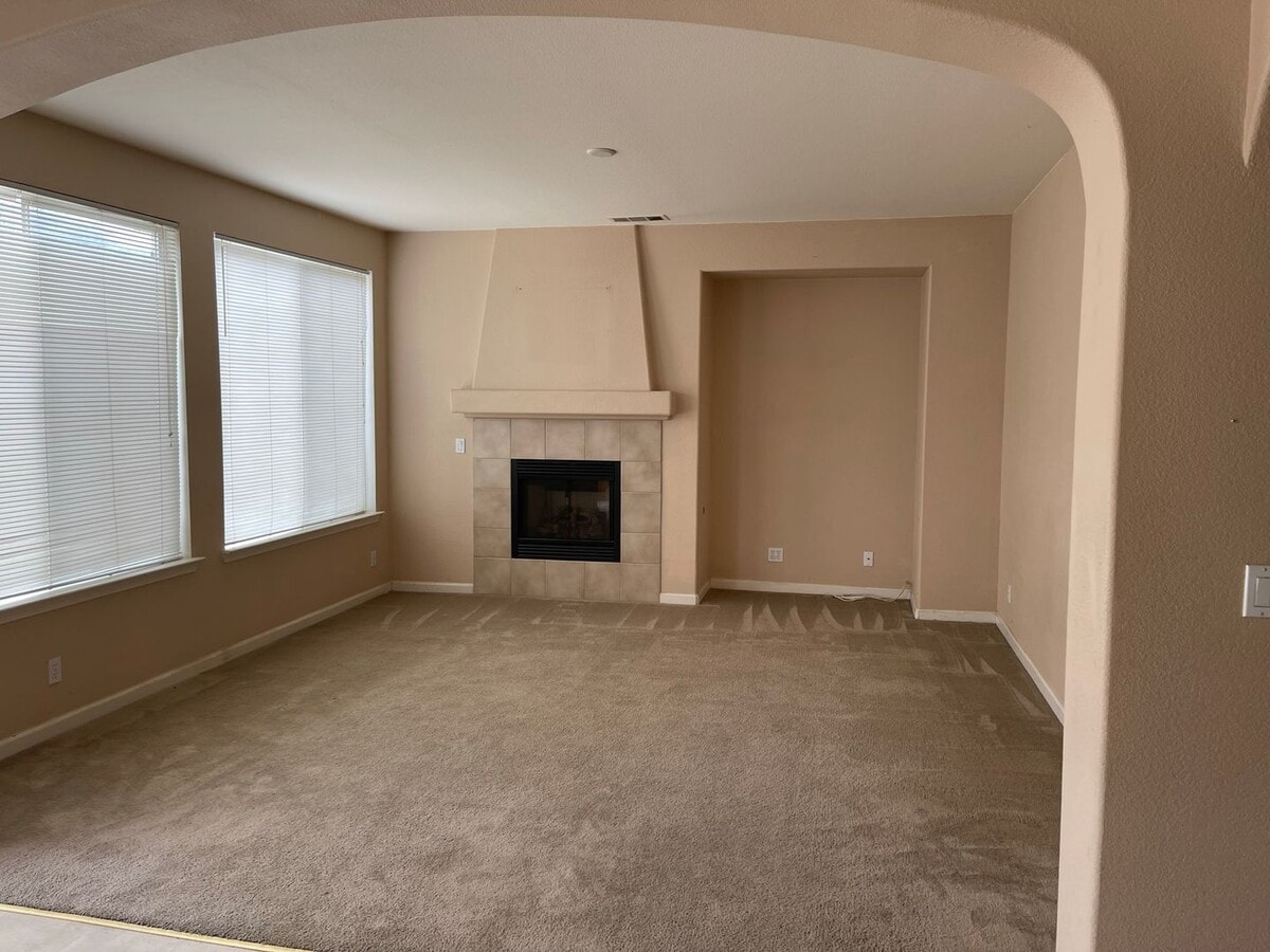 Photo - Spacious two-story home available for rent featuring 4 bedrooms, 2.5 bathrooms, and a three-car g...