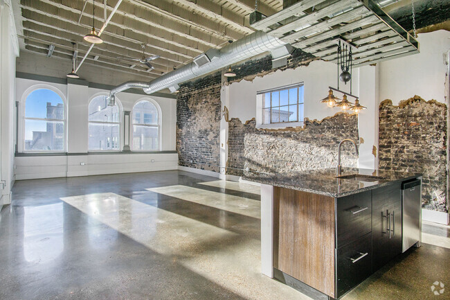 Exposed brick and plaster are unique to each unit - Ideal Building Rental