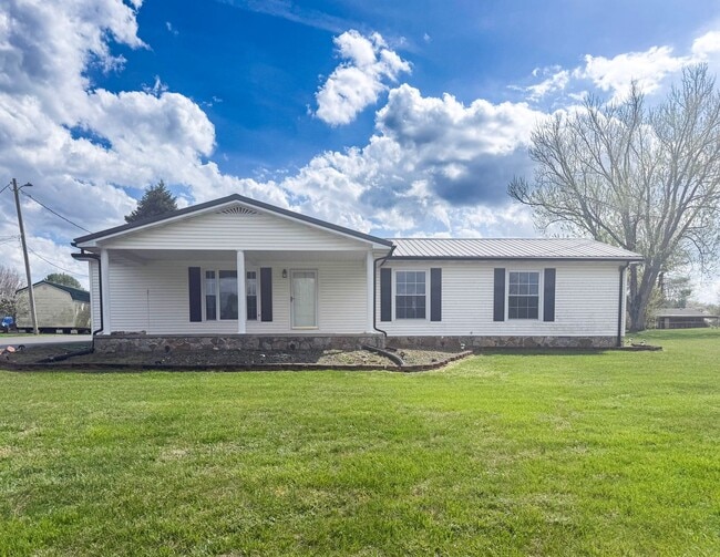 Building Photo - Spacious 3-Bedroom Home with Huge Yard, Covered Porches & Storage Building