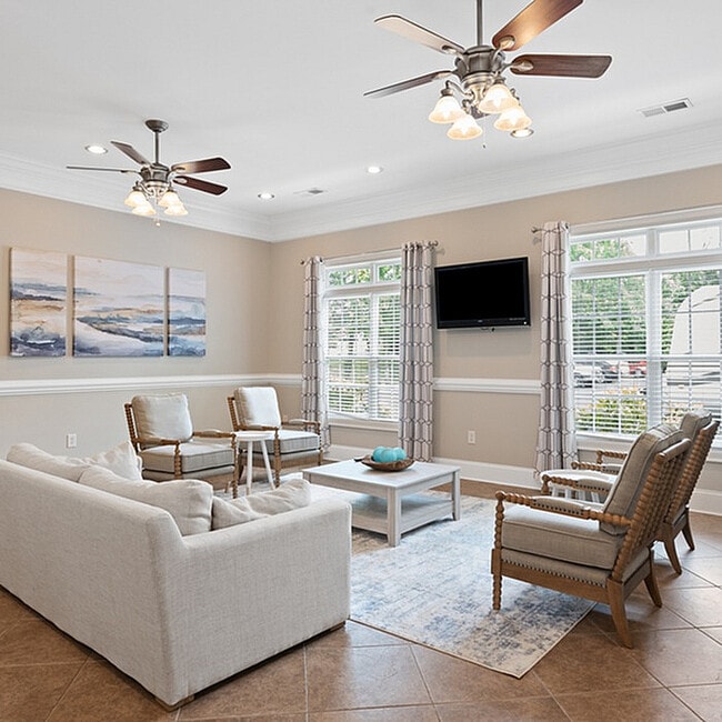 Experience comfort in this elegantly designed living room, perfect for relaxation and entertaining. - West Pointe