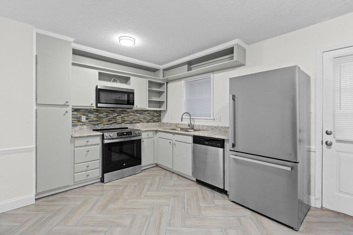 Photo - Updated Two-Bedroom Condo with New Kitchen Appliances and Private Patio