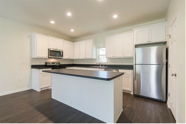 Stainless Steel Appliances comes with a fridge. - Highland Bourne Apartments