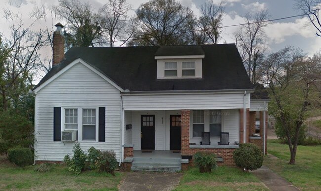 Main Entrance to home is door to left - 412 E 7th St Apartments Unit B