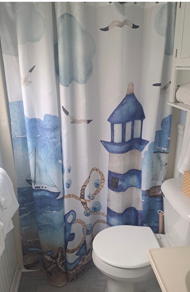 bath with sit down shower - 2315 Martins Point Rd Unit Martin's Point Cottage