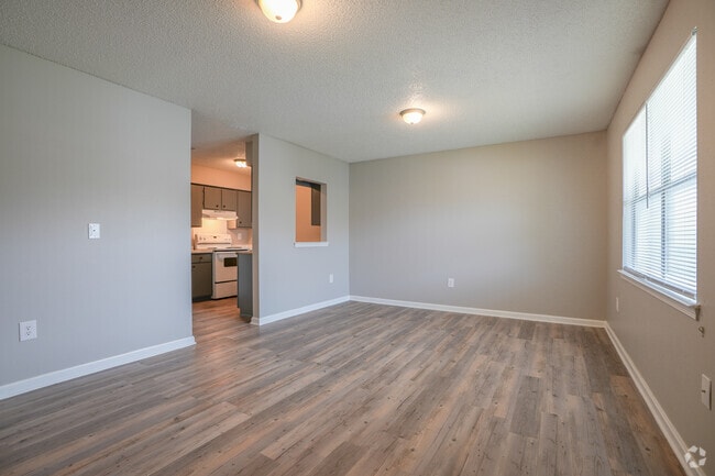 Two-Bedroom Living Room Afforded In-Coming Light - Riverwalk Apartments