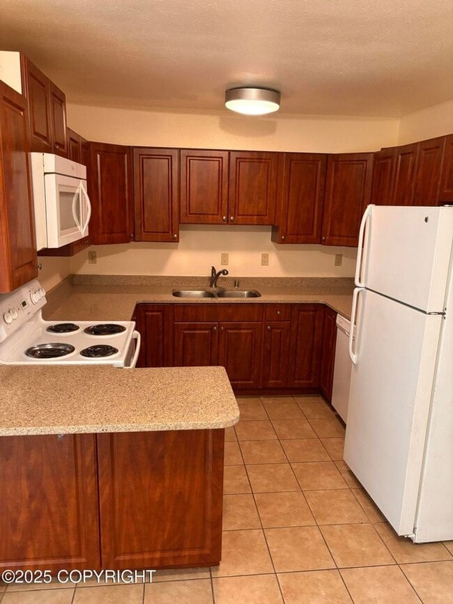 Building Photo - 1945 Karluk St Unit 02