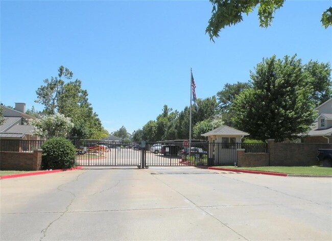 Gated entrance to Nantucket condos - 3200 W Britton Rd Unit Condo #281 - 2nd Floor