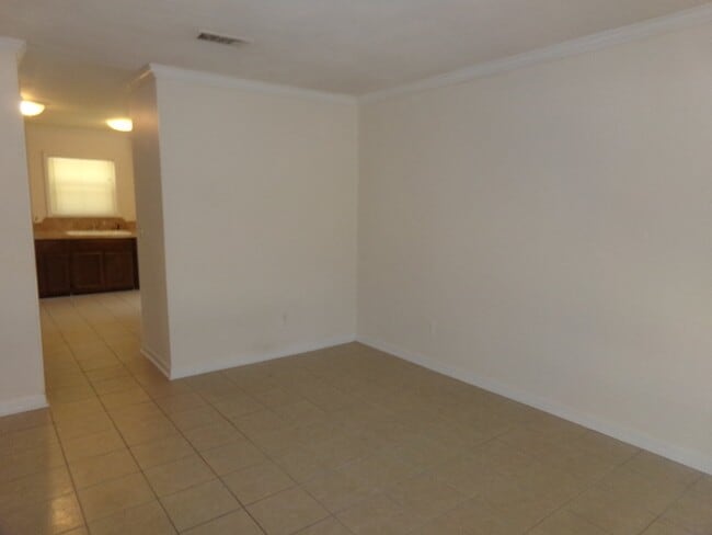 Photo - 2BR/1BA Milton Duplex with Huge Fenced Backyard, Tile Flooring Throughout & Convenient Access to ...