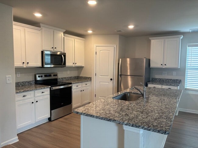 Photo - Beautiful 4 Bedroom 2.5 Bath House with Fenced Yard Available! Pet Friendly!