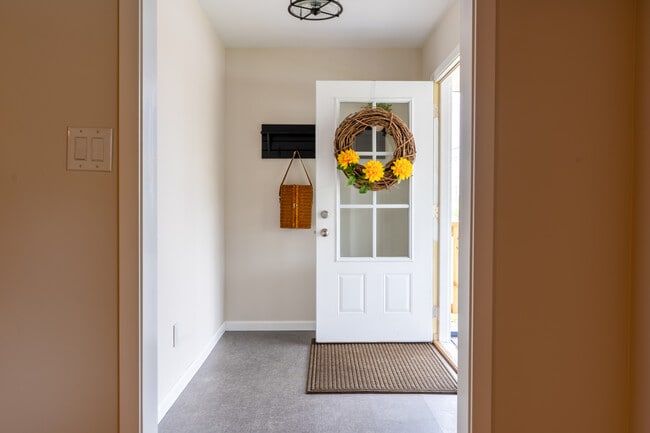 Foyer 5.6 X 9.6 New foyer light, Custom coat rack and new, durable Luxury Vinyl Tile flooring - 945 E Worthsville Road