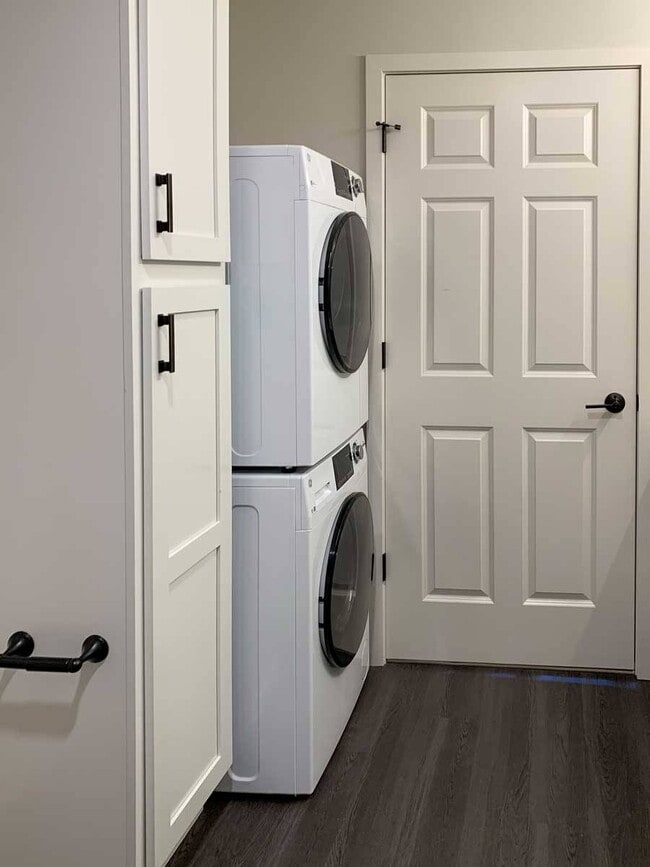 Tucked-away stackable washer and dryer add convenience and functionality to your home. - The Knock Apartments