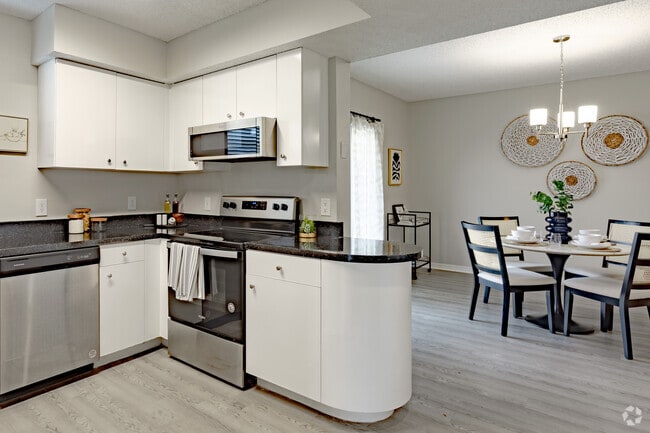 2BR, 2BA - The Cypress - Kitchen And Dining Room - ARIUM Cypress Lakes