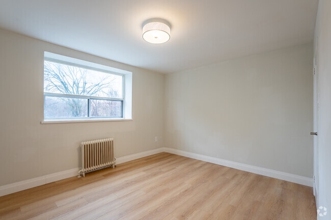 2BR, 1BA - 876SF - Primary Bedroom - Sandalwood Manor