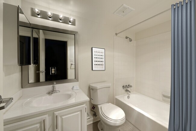 Finish Package II bathroom with white cabinetry and countertop