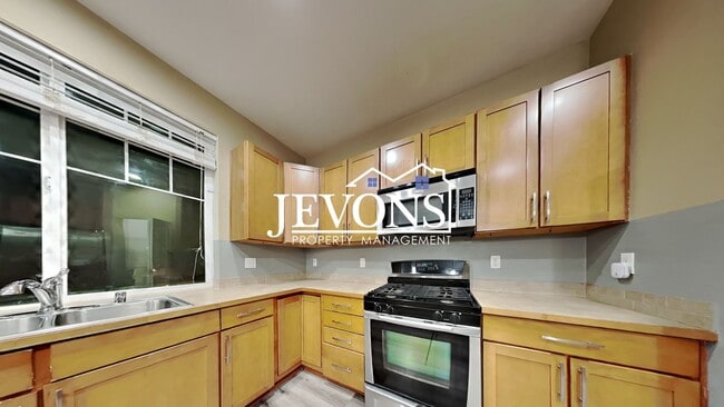 Photo - Experience this beautiful SeaTac single-family home with an equipped kitchen, high ceilings, near...