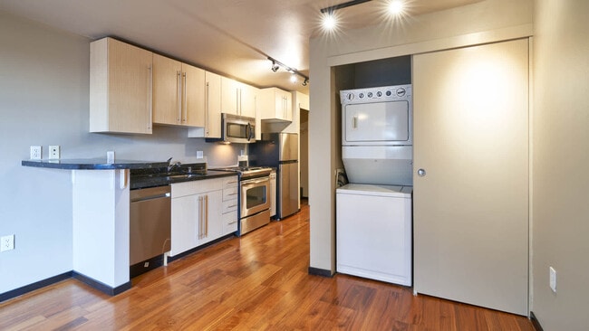 Kitchen with Stainless Steel Appliances and In-home Washer and Dryer