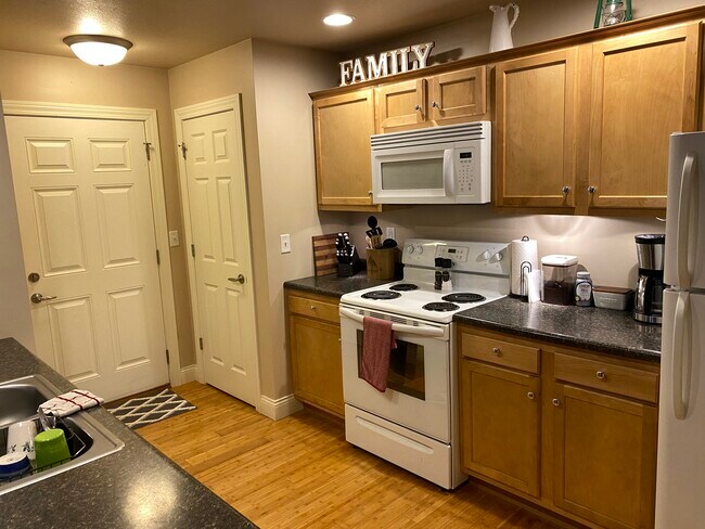 Kitchen with closet, pantry, and garage entrance. - 109 Scenic Dr