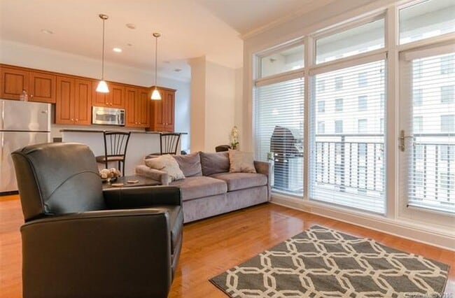 Living Room with access to Balcony - 230 S Tryon St Condo Unit 605