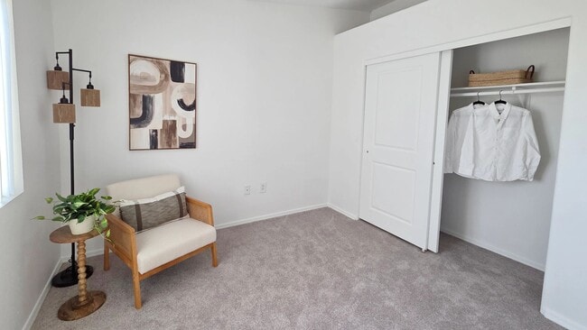 Designed with comfort in mind, this spacious bedroom offers abundant storage, natural light, and a clean, modern aesthetic that feels like home.