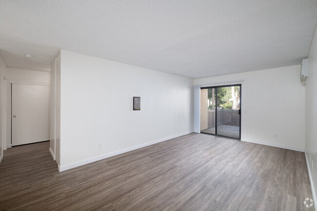 1BR, 1BA - 716SF - Living Room - 55+ Senior Living at Quail Creek Apartments