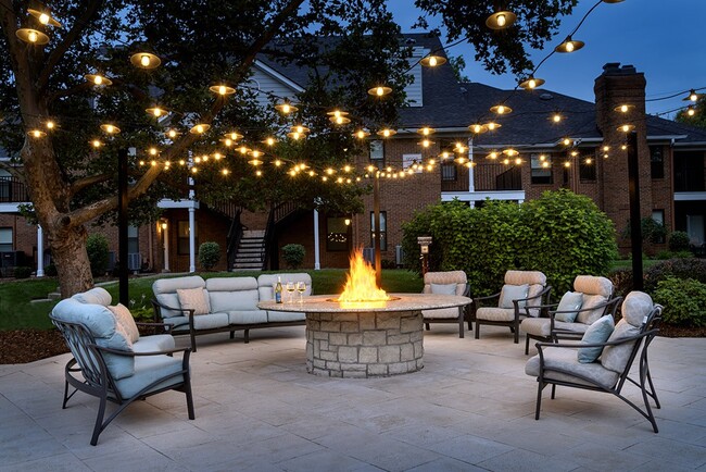 Cozy fire pit at dusk - The Willows of Plainview Apartments