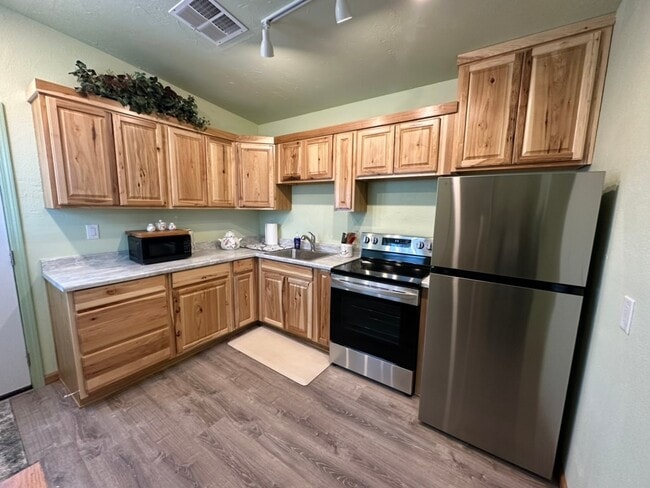 Large kitchen with brand new kitchen cabinets and appliances - 400 Main St Apartment Unit A
