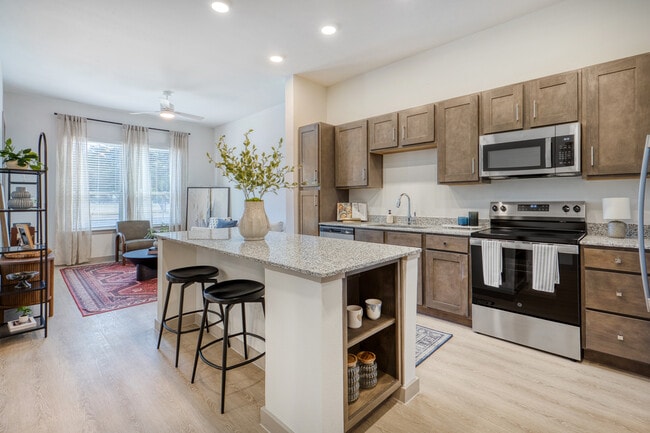 Open-concept kitchen and living space with a spacious layout designed for everyday living at Mesquit