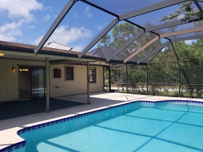 Photo - 3/2/1 with screened in patio/pool