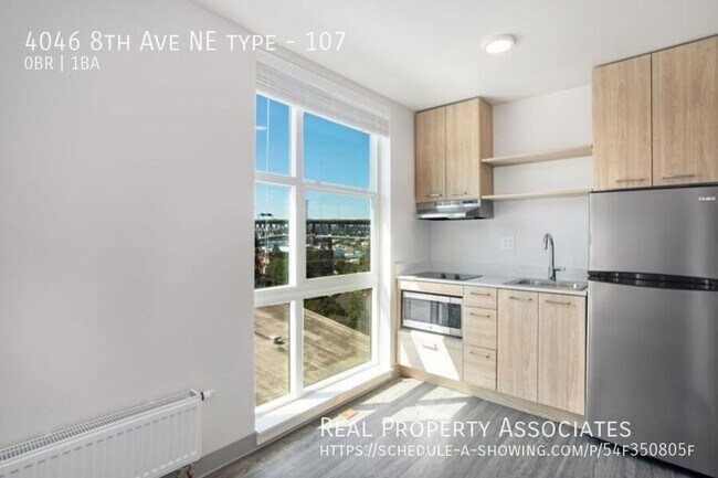 Building Photo - 4046 8th Ave NE Unit 107