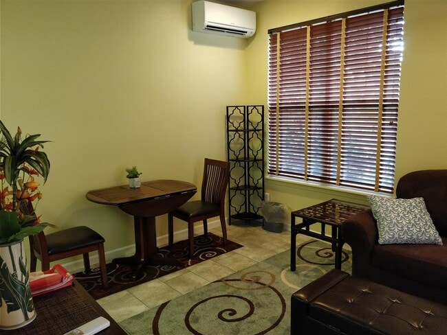 Living + Dining area now with tile and area rugs